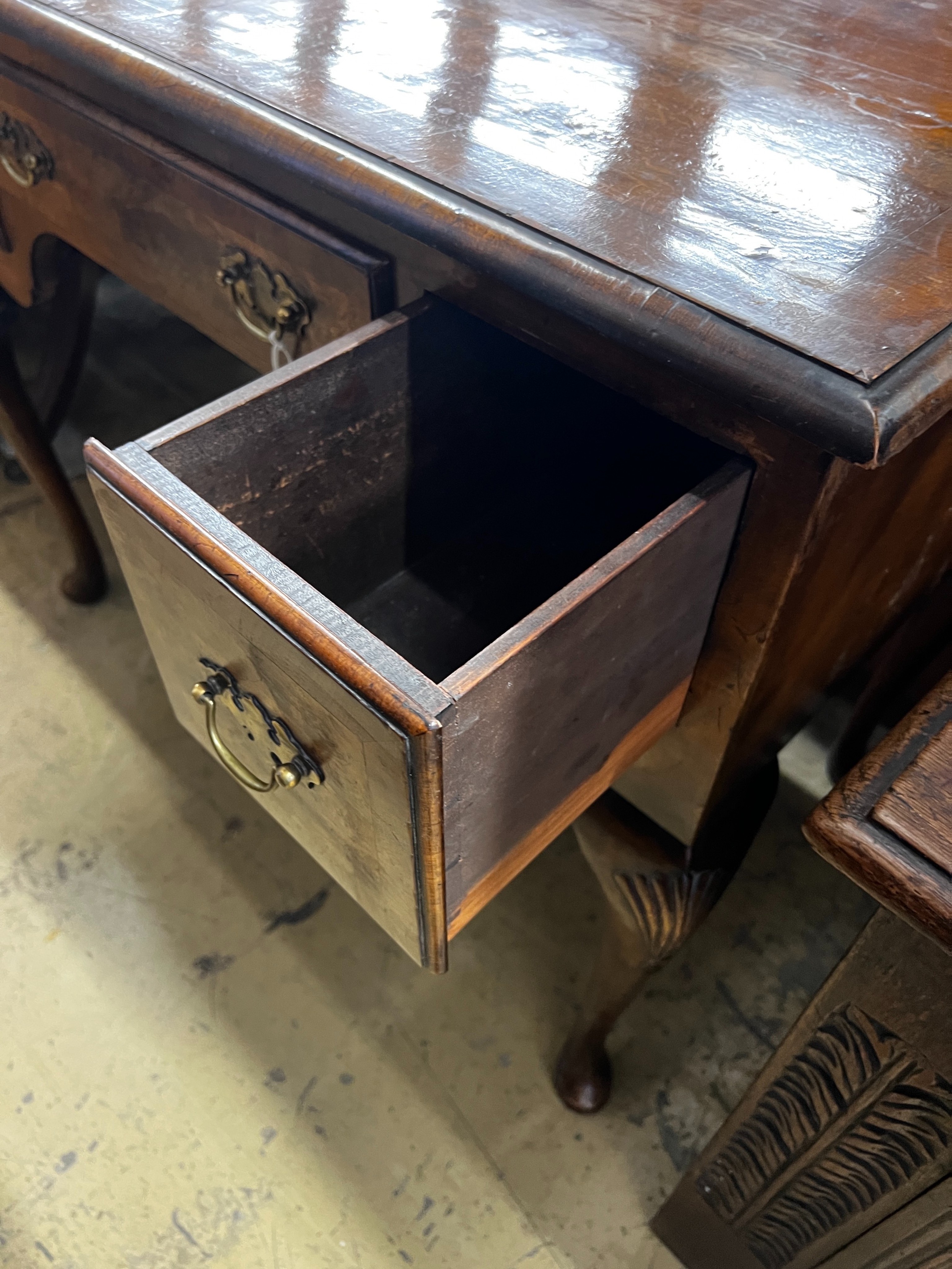 A Queen Anne revival walnut kneehole table, length 92cm, depth 53cm, height 76cm